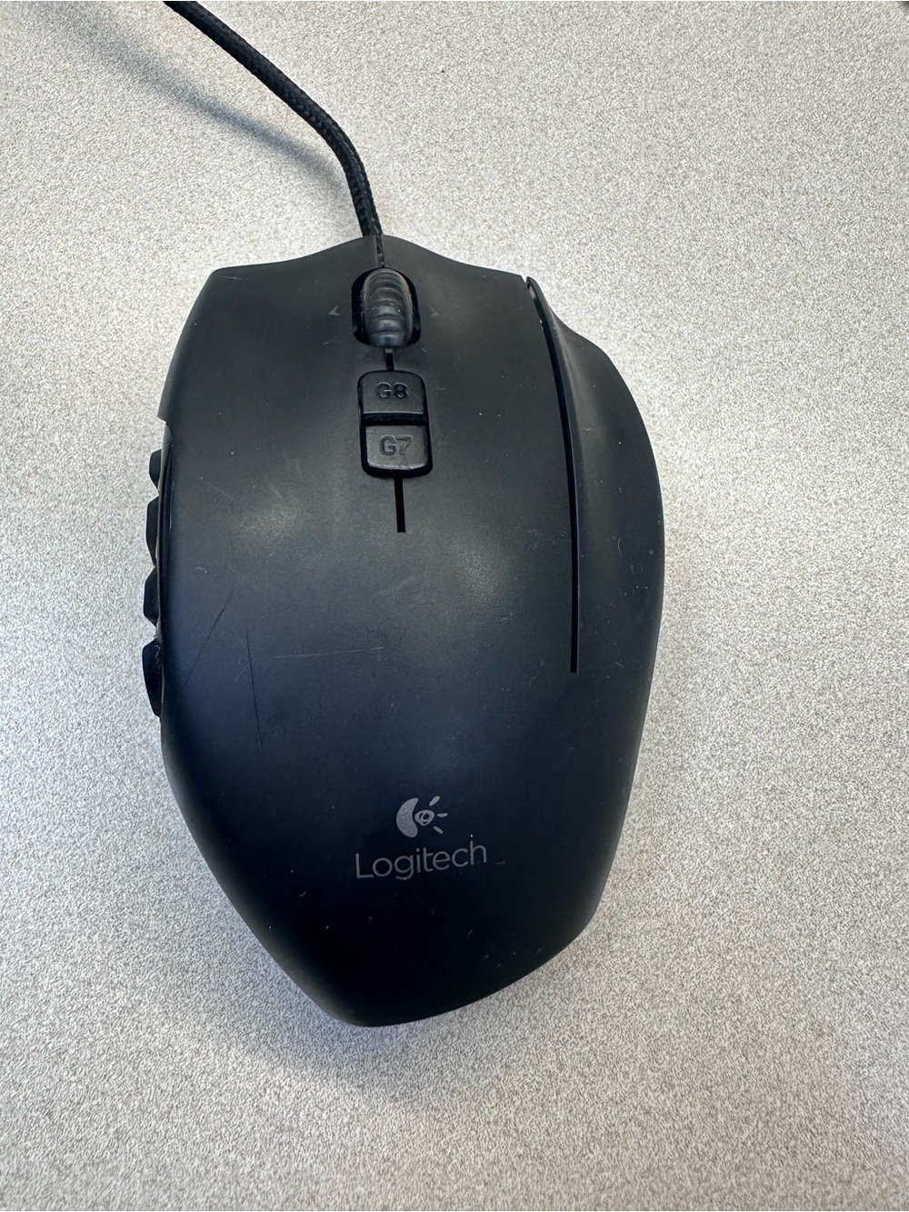 Logitech G600 Black Wired Ergonomic Gaming Mouse with 12 button thumb grid.